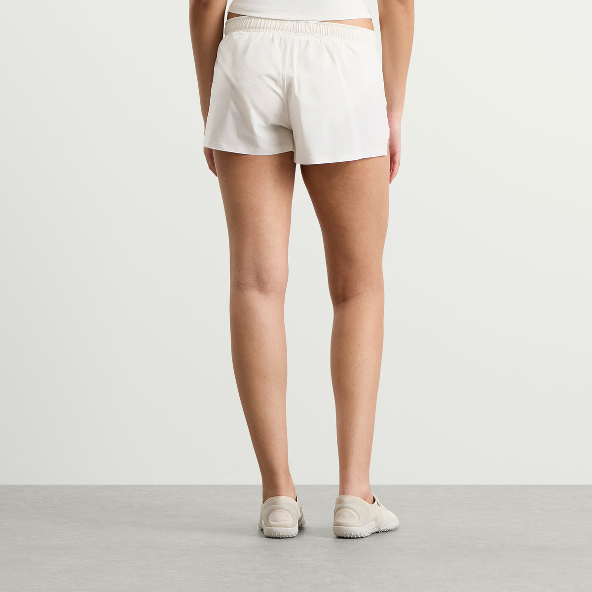 Nike Women's x SKIMS Stretch Nylon Runner Short in Ivory