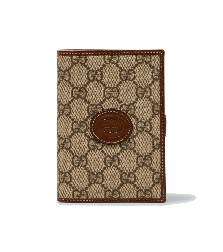 Photo: Gucci - GG Supreme passport holder