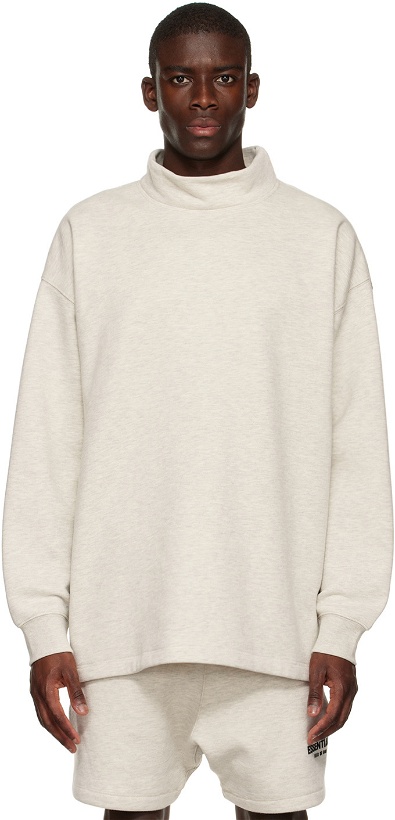 Photo: Fear of God ESSENTIALS Off-White Relaxed Mock Neck Sweatshirt