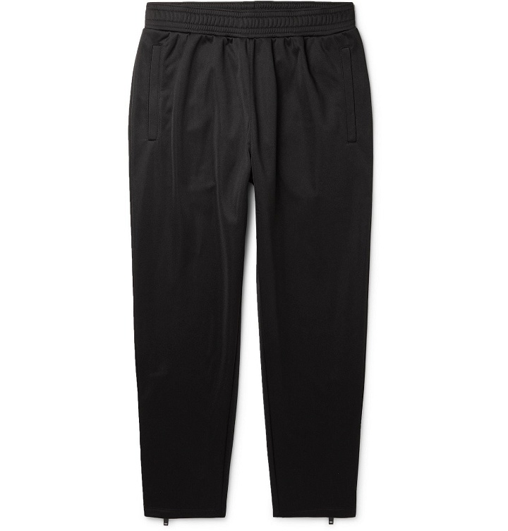 Photo: Givenchy - Tapered Logo-Appliquéd Fleece-Back Tech-Jersey Track Pants - Black