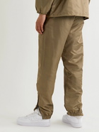 FEAR OF GOD ESSENTIALS - Tapered Logo-Appliquéd Taslan Nylon Track Pants - Brown