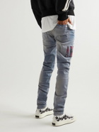 AMIRI - Skinny-Fit Appliquéd Distressed Jeans - Blue
