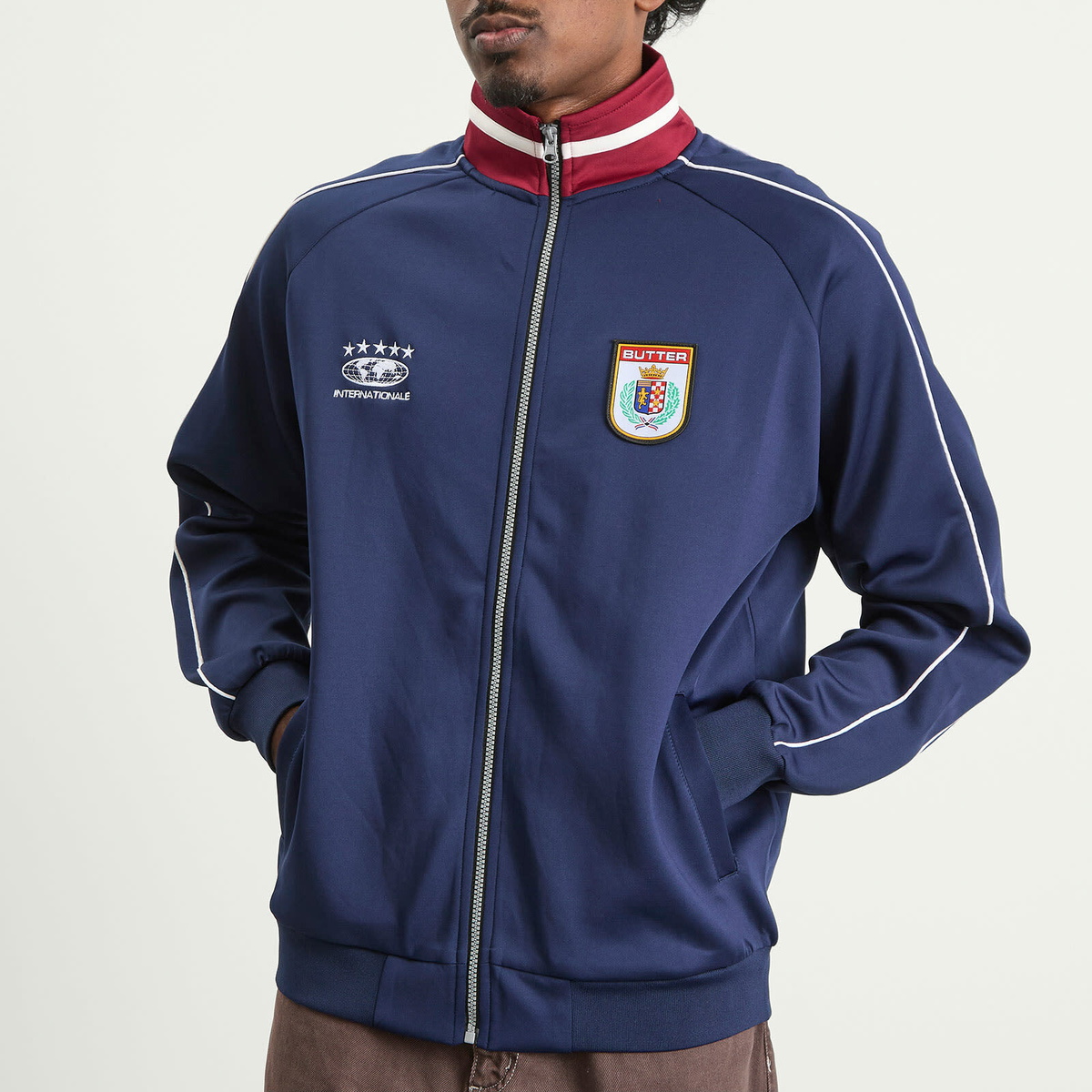 Butter Goods Men's Internationale Track Jacket in Navy
