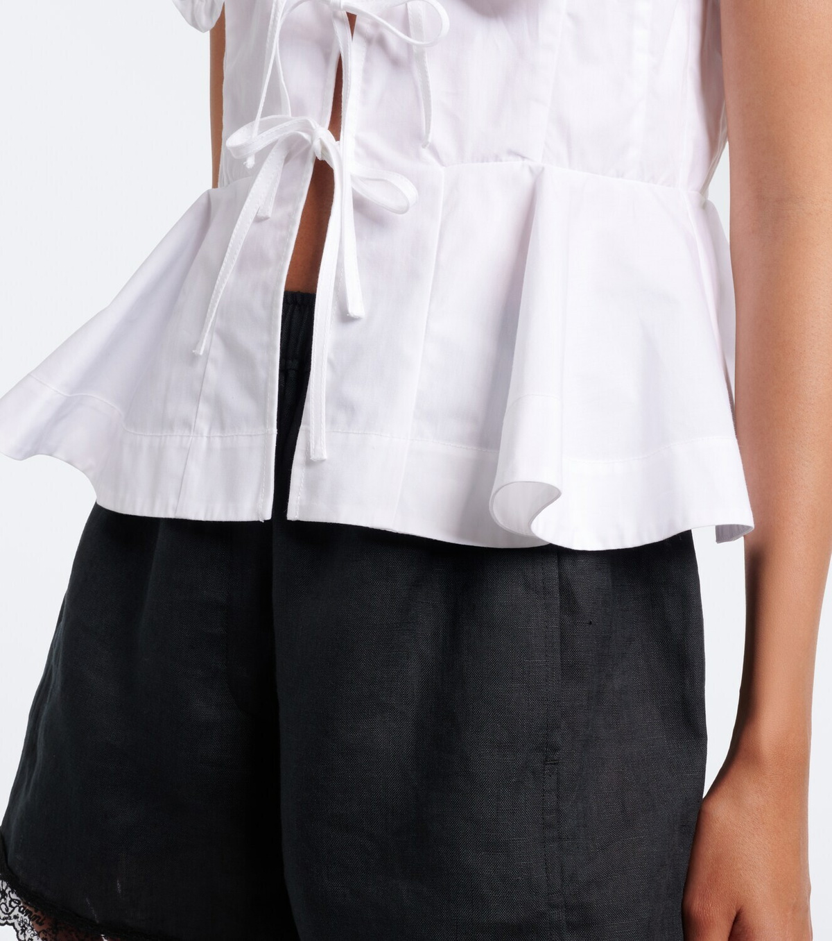 Ganni Bow-detail peplum cotton poplin blouse