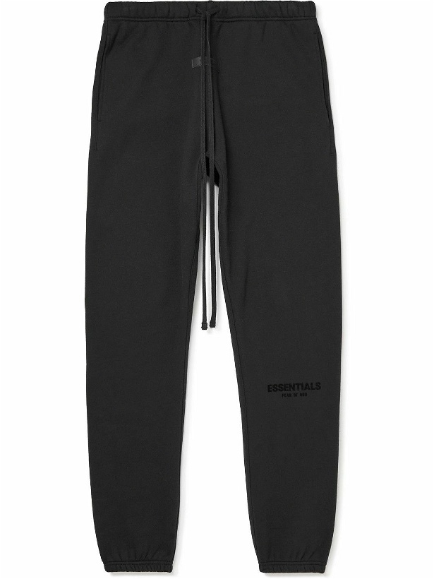 Photo: FEAR OF GOD ESSENTIALS - Tapered Logo-Flocked Cotton-Blend Jersey Sweatpants - Black