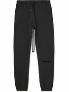 FEAR OF GOD ESSENTIALS - Tapered Logo-Flocked Cotton-Blend Jersey Sweatpants - Black