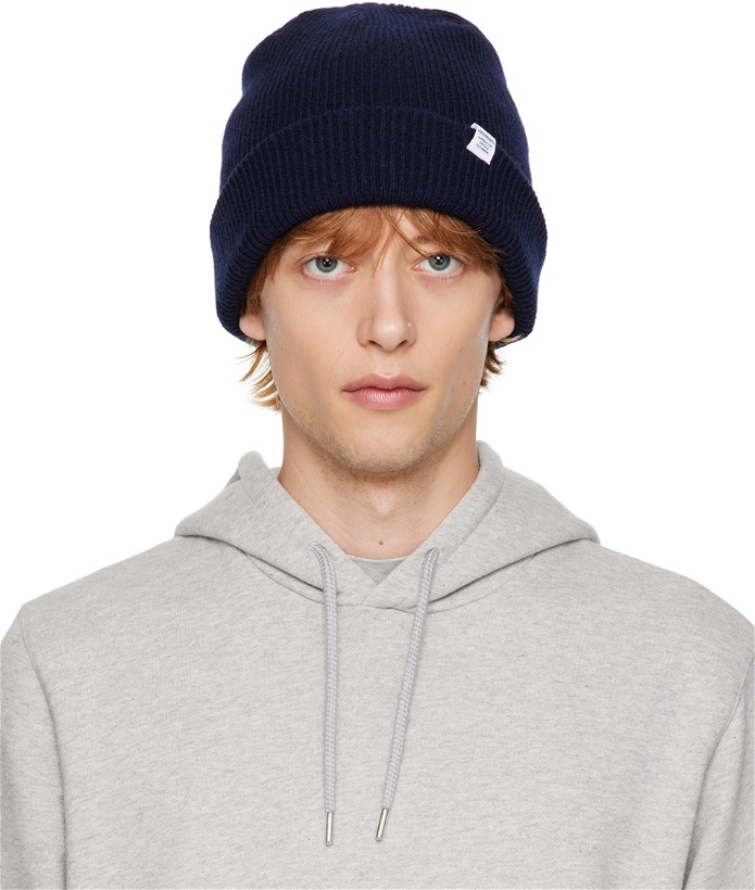 Photo: NORSE PROJECTS Navy Rolled Brim Beanie