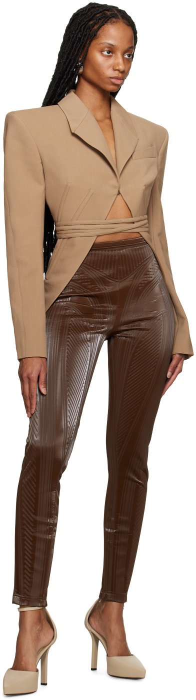 https://cdn.clothbase.com/uploads/4370d730-cac8-413b-8a7b-33c9038de367/brown-embossed-leggings.jpg