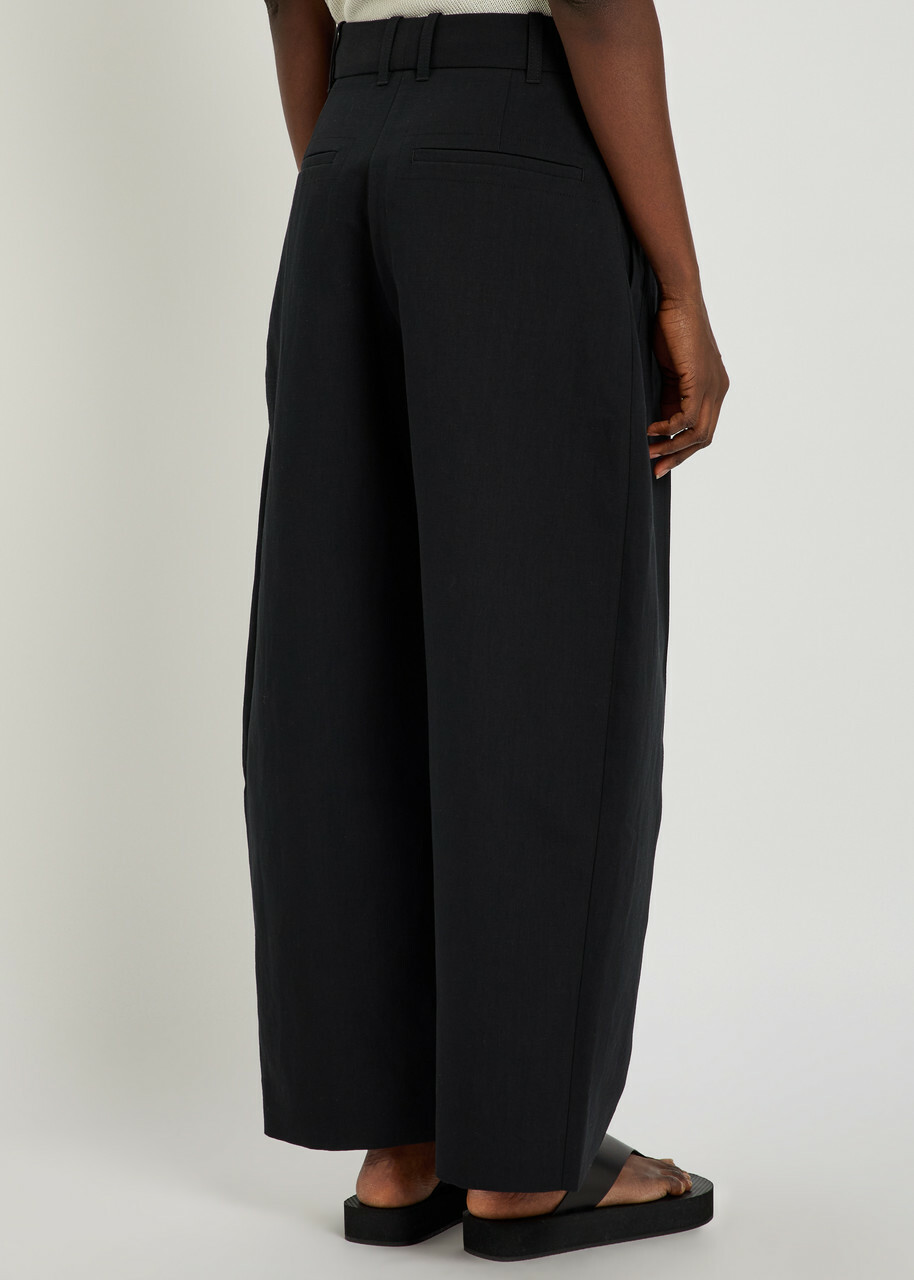 Studio Nicholson Barrel-leg Cotton and Linen-blend Trousers Black