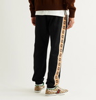 Gucci - Slim-Fit Logo-Jacquard Webbing-Trimmed Tech-Jersey Track Pants - Black