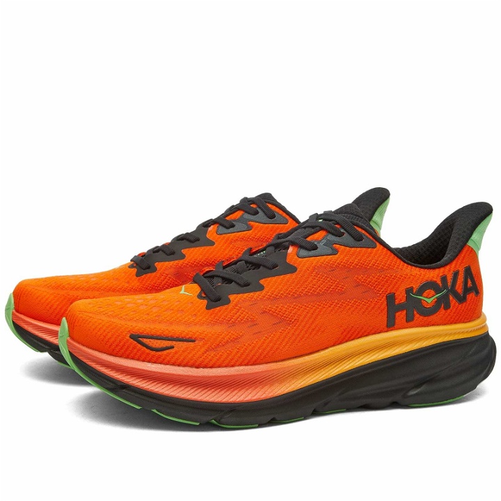 Photo: Hoka One One Men's Clifton 9 Sneakers in Flame/Vibrant Orange