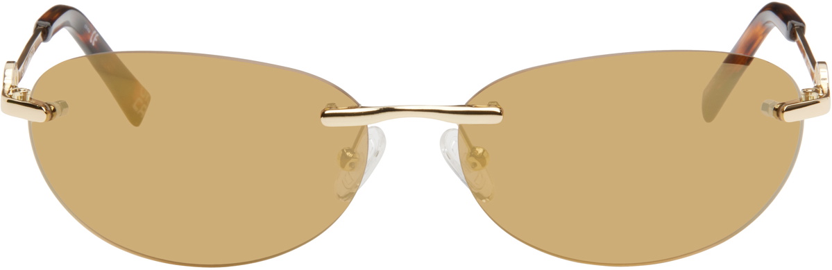Le Specs | Slinky Sunglasses in Gold Le Specs Odyssey- Gold – Hand In Pocket main image 2