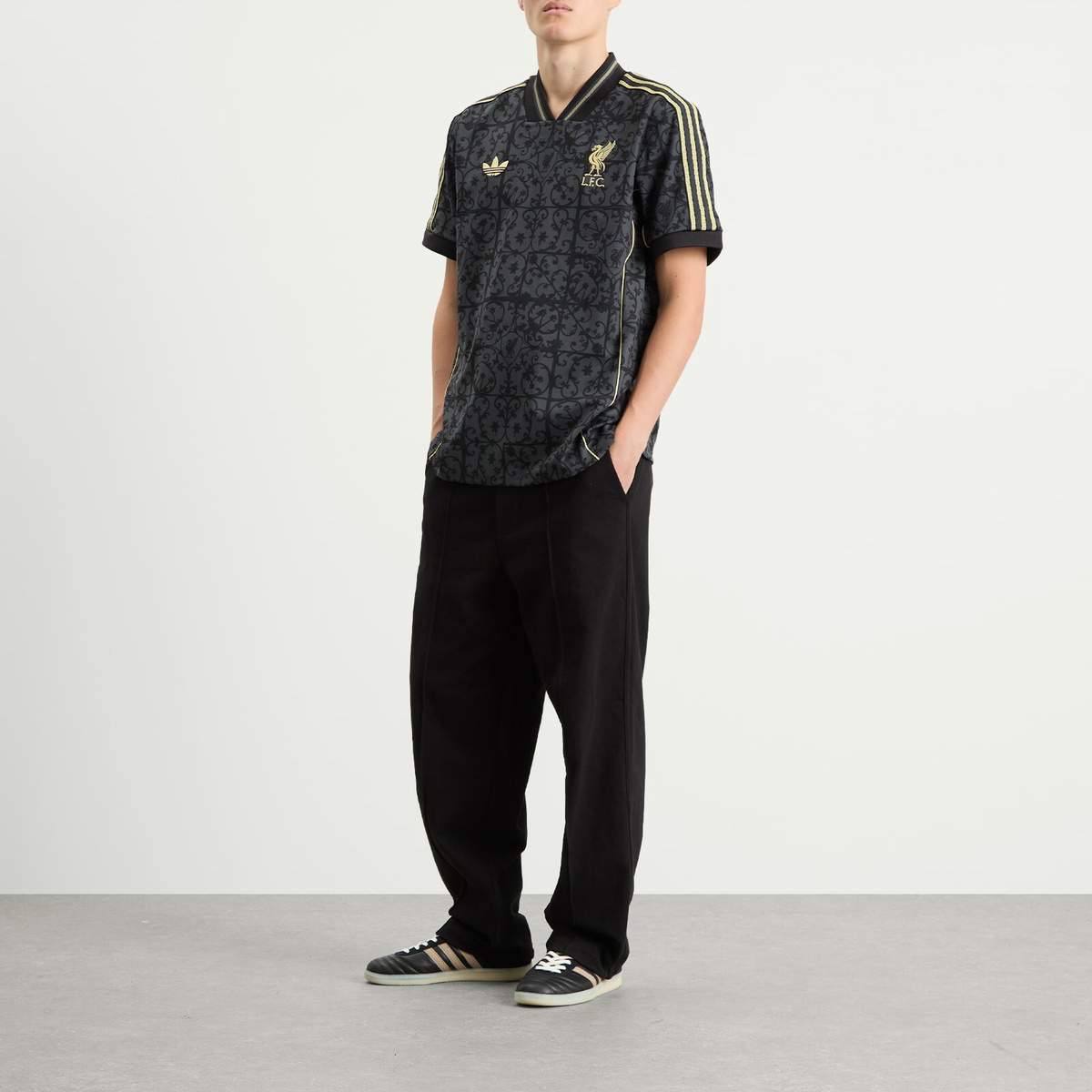 Adidas Liverpool FC. Lifestyler Jersey Top in Carbon/Halo Gold