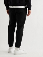 FRAME - Tapered Logo-Print Fleece-Back Cotton-Blend Jersey Sweatpants - Black