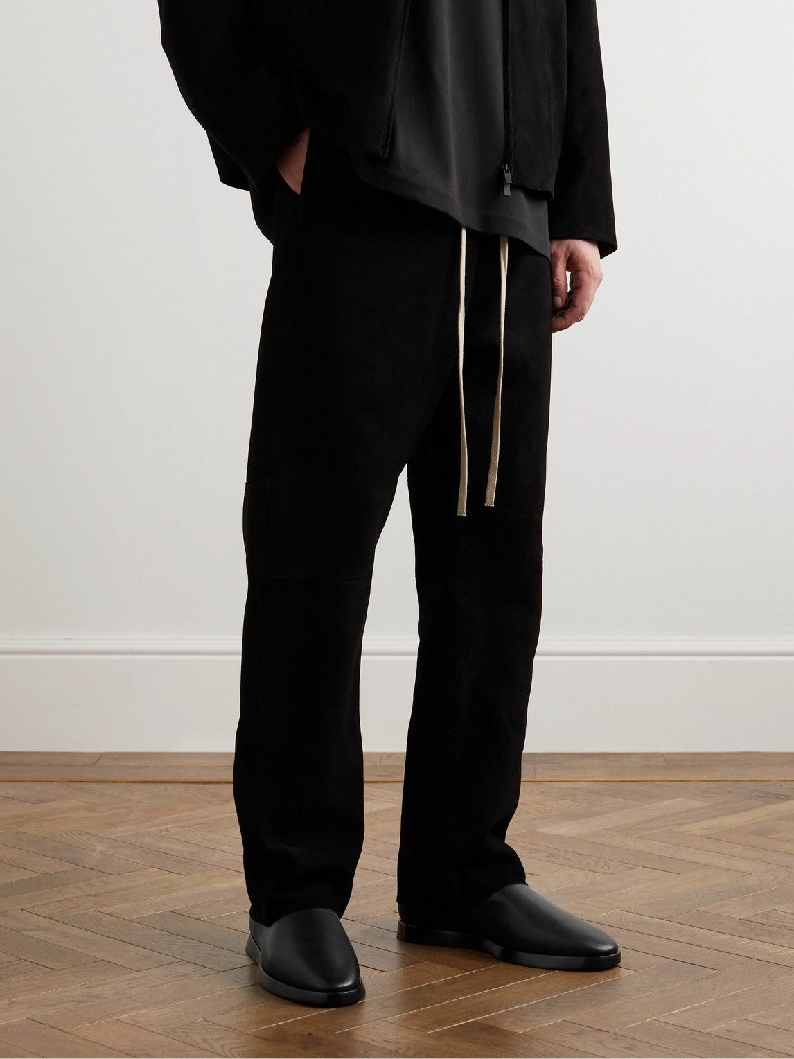 fear of god moccasin black on feet