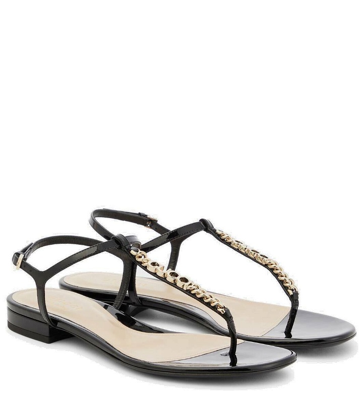 Photo: Gucci Logo embellished patent leather thong sandals