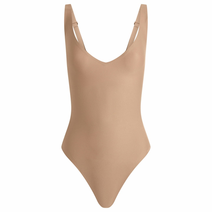 Photo: SKIMS Women's Body Core Sculpt Plunge Thong Bodysuit in Sienna