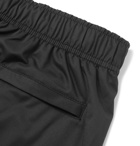 Stüssy - Tapered Logo-Print Shell Sweatpants - Black