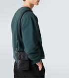 Gucci GG Emblem debossed leather phone pouch