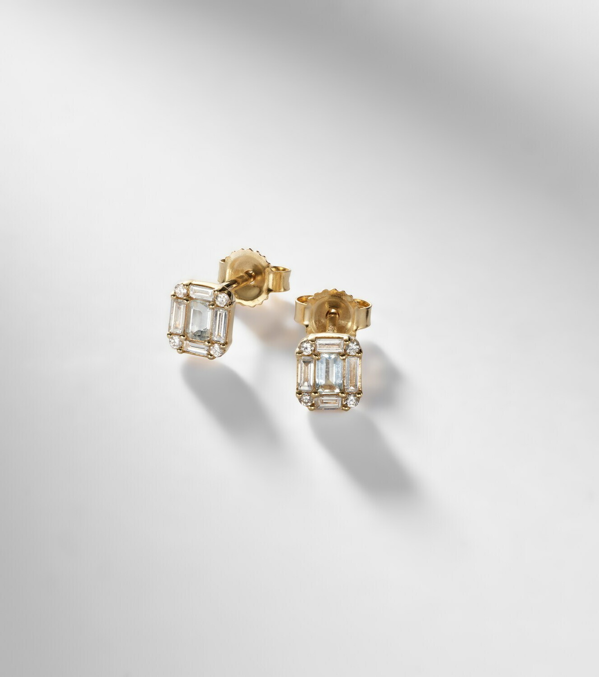 Stone and Strand Shield Of Strength 14kt gold earrings with diamonds and aquamarine