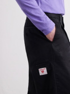 Human Made - Tapered Pleated Cotton-Canvas Trousers - Black