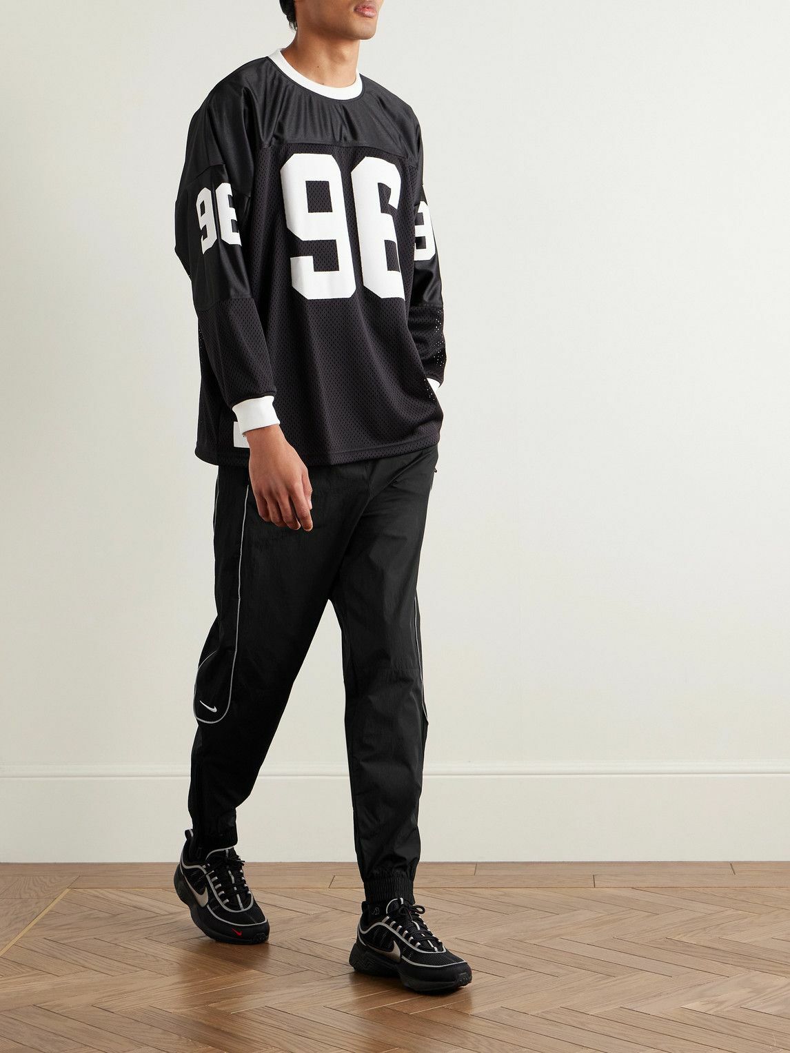 Nike - Solo Swoosh Logo-Embroidered Nylon Track Pants - Black