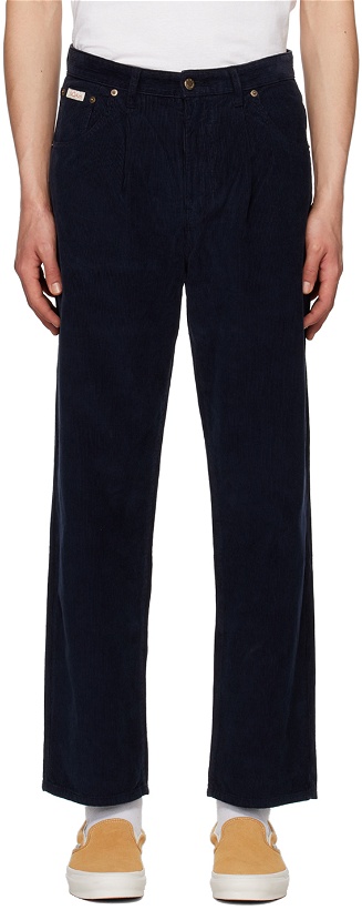 Photo: Noah Navy Pleated Trousers