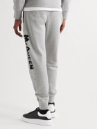ALEXANDER MCQUEEN - Tapered Logo-Print Mélange Loopback Cotton-Jersey Sweatpants - Gray