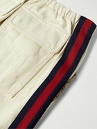 GUCCI - Webbing-Trimmed Logo-Jacquard Cotton-Blend Canvas Trousers - Neutrals