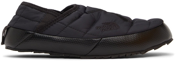 Photo: The North Face Black KAWS Edition Thermoball Traction Nuptse Mules