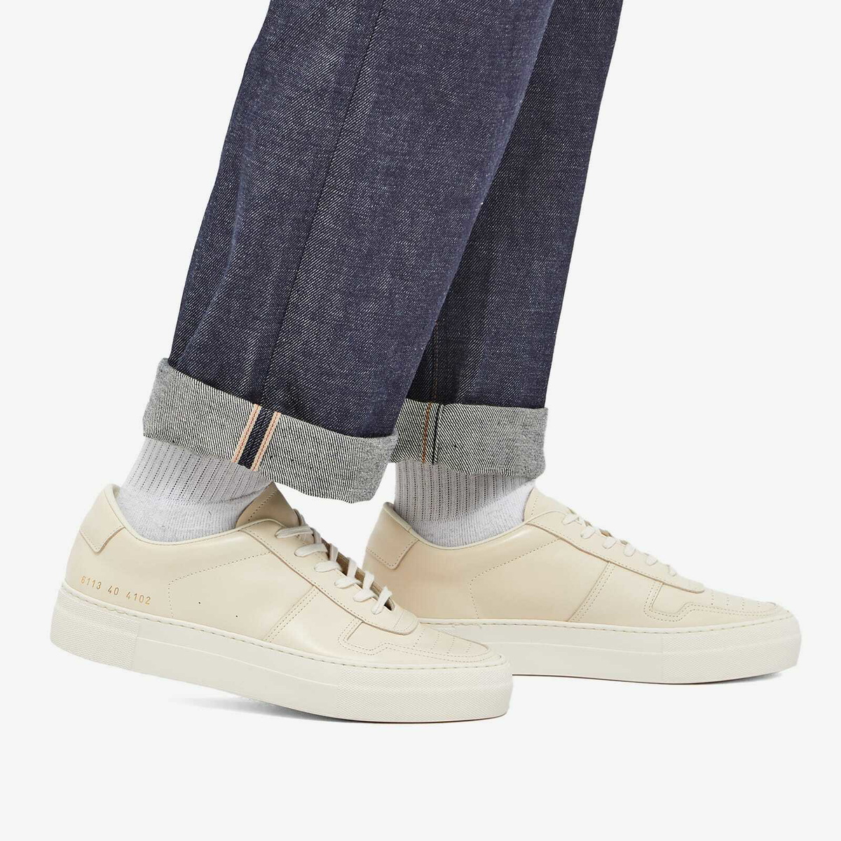 Woman by Common Projects Women's Cross Trainer Sneakers in White