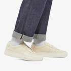 Woman by Common Projects Women's Cross Trainer Sneakers in White
