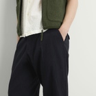 Universal Works Men's Ospina Cotton Pleated Track Pant in Dark Navy