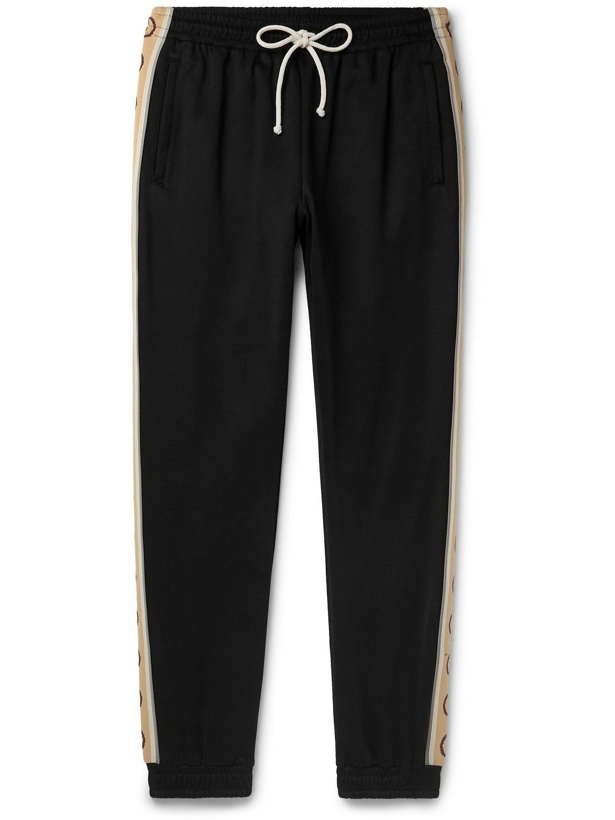 Photo: GUCCI - Tapered Logo-Jacquard Webbing-Trimmed Tech-Jersey Track Pants - Black