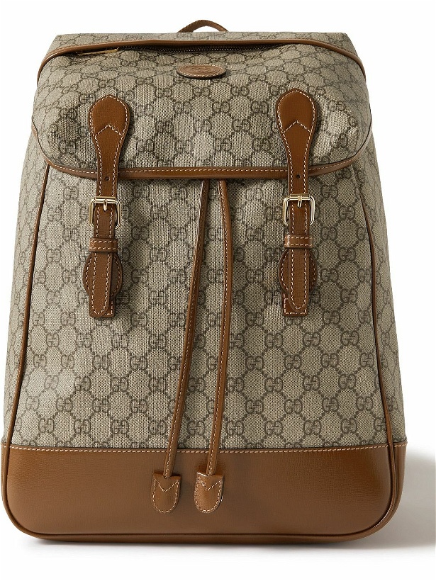 Photo: GUCCI - Leather-Trimmed Monogrammed Coated-Canvas Backpack