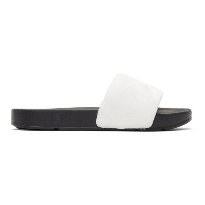 Photo: Baja East White and Black Fila Edition Shearling Drifter Slides