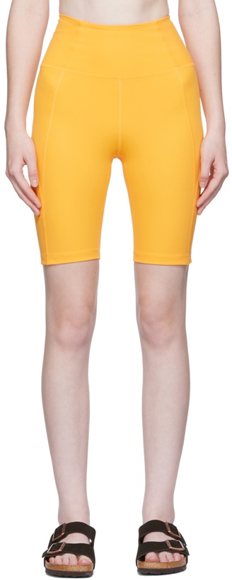 Photo: Girlfriend Collective Orange High-Rise Bike Shorts