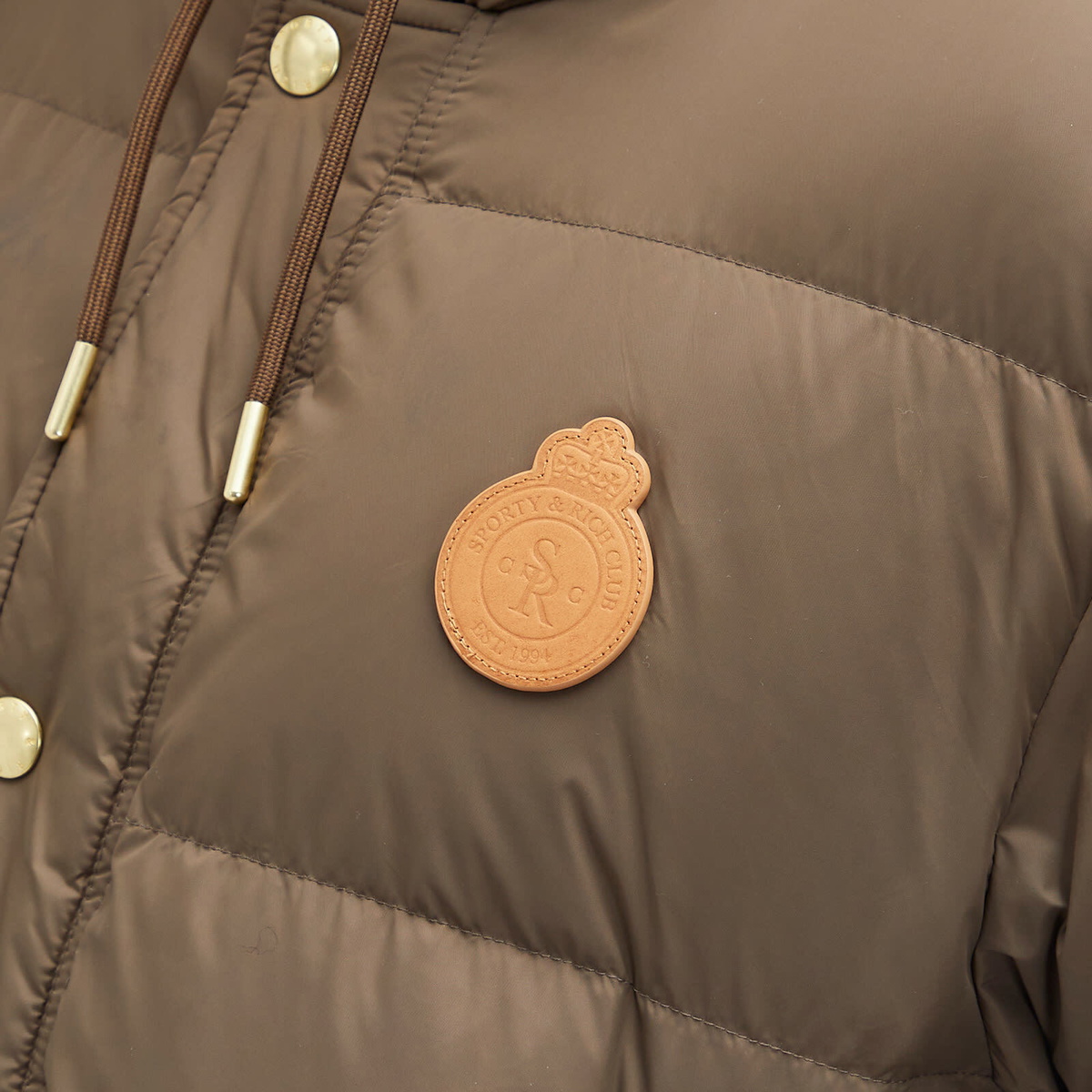 Sporty & Rich Women's Crown Puffer Jacket in Chocolate Tan