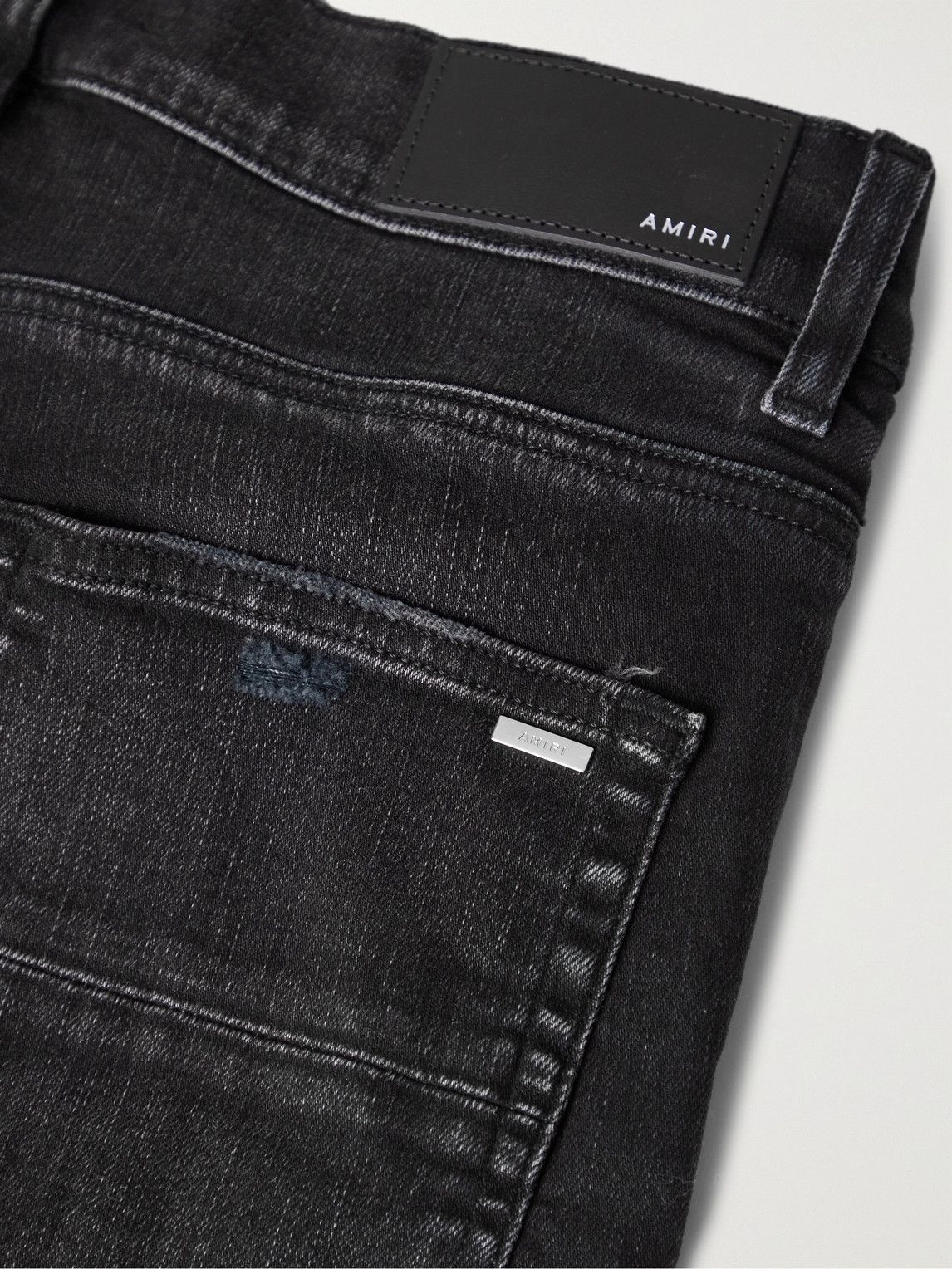 AMIRI - Skinny-Fit Logo-Embroidered Distressed Jeans - Black Amiri