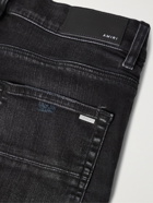 AMIRI - Skinny-Fit Logo-Embroidered Distressed Jeans - Black