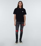 Amiri MX1 distressed skinny jeans