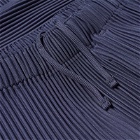 Homme Plissé Issey Miyake Men's Pleated Tapered Trousers in Blue Charcoal