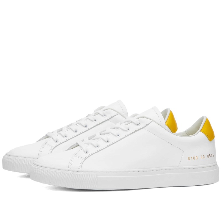 Photo: Woman by Common Projects Women's Retro Low Sneakers in White/Yellow