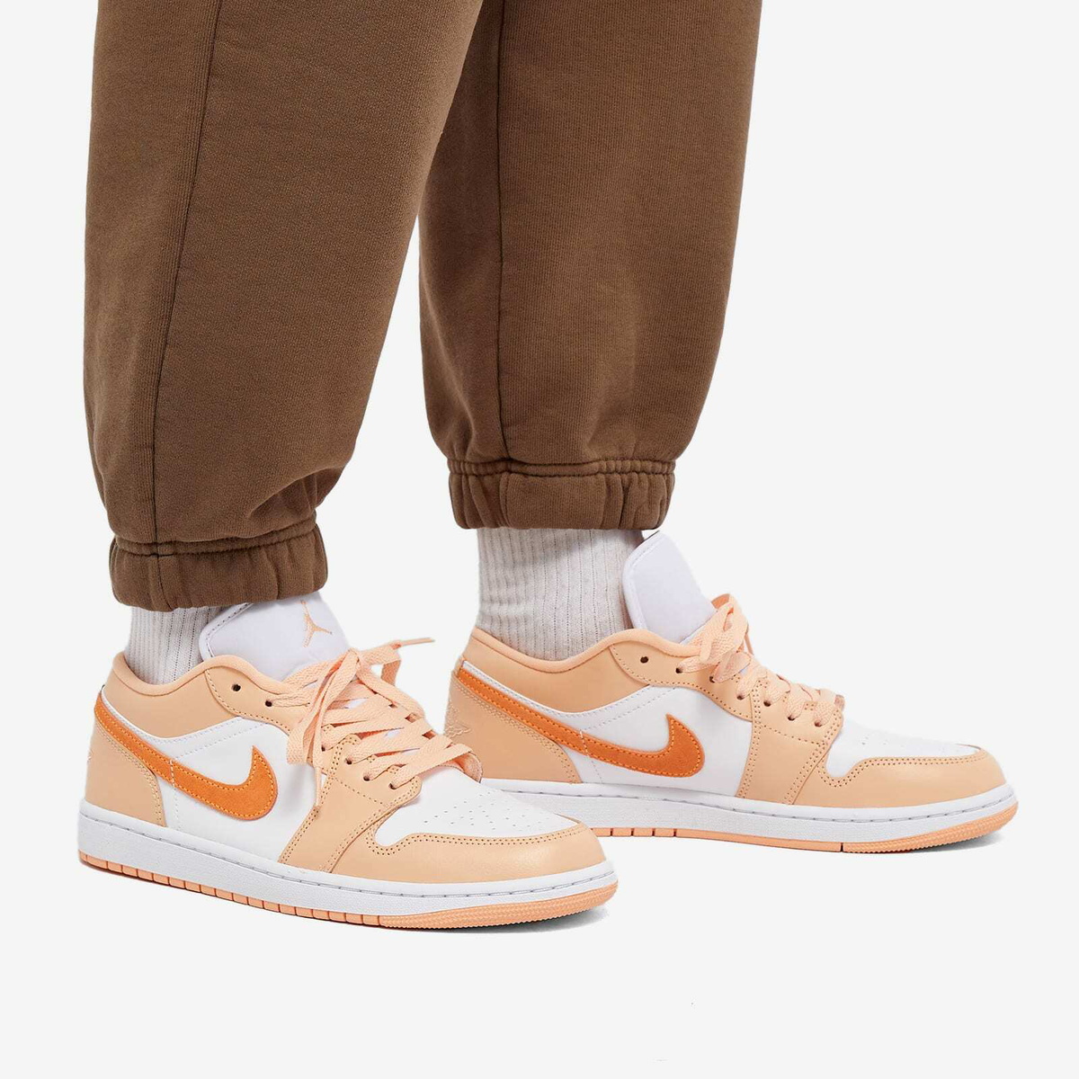 Air Jordan Women's 1 Low W Sneakers in Sunset Haze/Bright Citrus