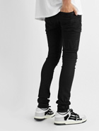 AMIRI - Skinny-Fit Logo-Appliquéd Distressed Jeans - Black