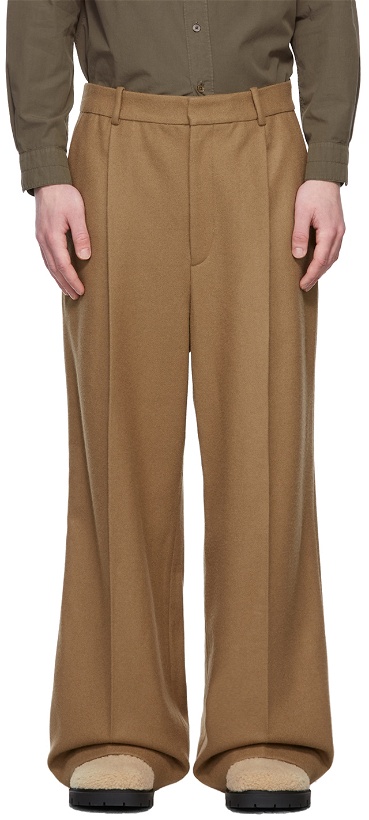 Photo: Hed Mayner Tan Wool Elongated Trousers