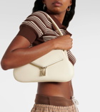Amina Muaddi Gemini Flat leather shoulder bag