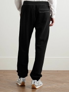 Givenchy - Tapered Logo-Appliquéd Cotton-Jersey Sweatpants - Black