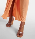 Amina Muaddi Lupita Half Glass PVC and suede wedge mules