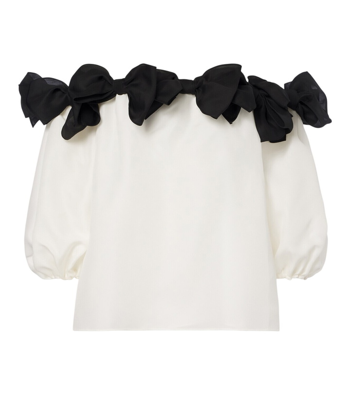 Photo: Carolina Herrera Bow-detail off-shoulder silk top
